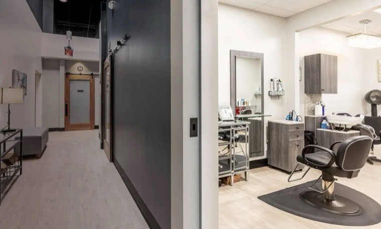 Private salon suite with a styling chair, mirror and shampoo bowl